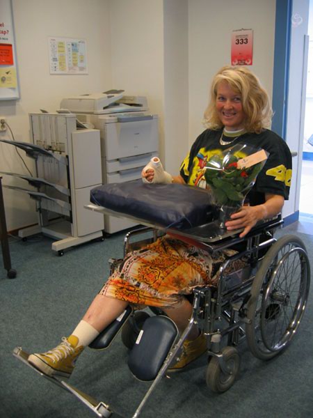 Sylvia with flowers, in wheelchair