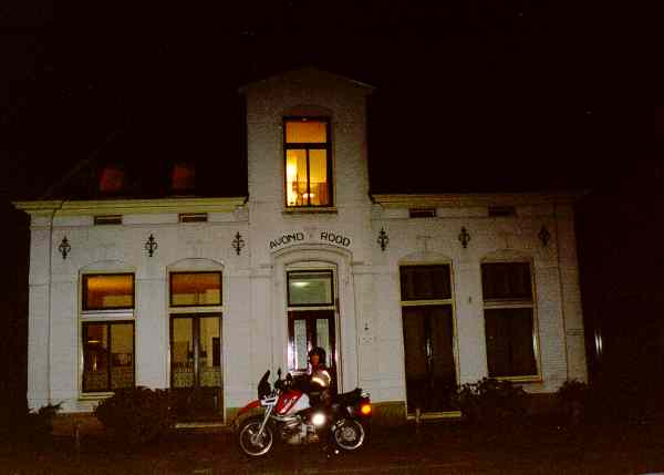 At night: motorcycle in front of a house