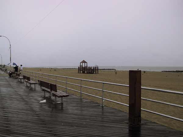 Wet beach, wooden boardwalk