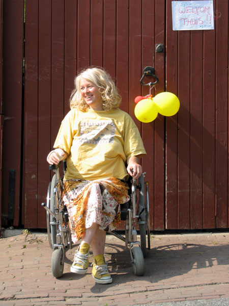 Sylvia at the front door, balloons and note with Welcome