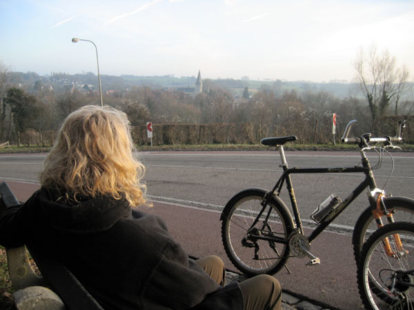 Sylvia enjoying a view, bicycle in front