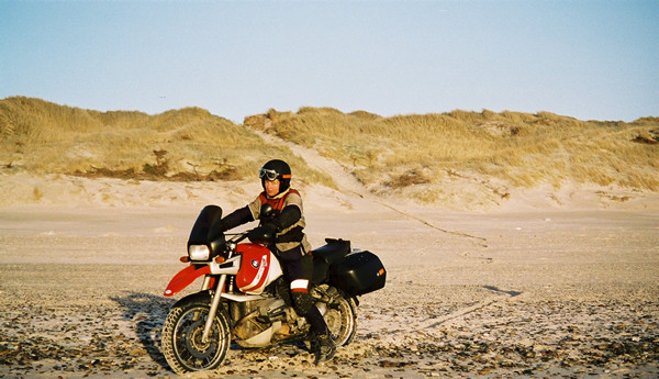 Red and white R1100GS on the beach