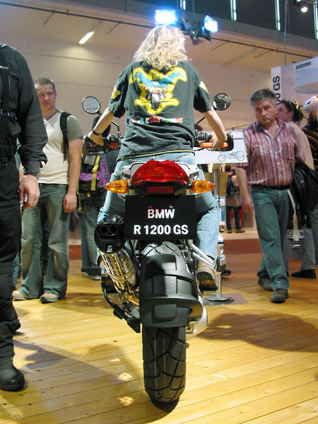 Sylvia on a BMW R1200GS at Intermot