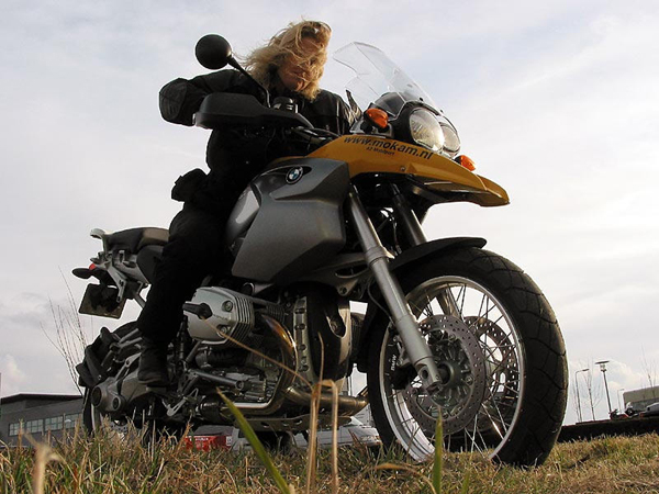 Yellow BMW R1200GS from Mokam, with Sylvia sitting on it