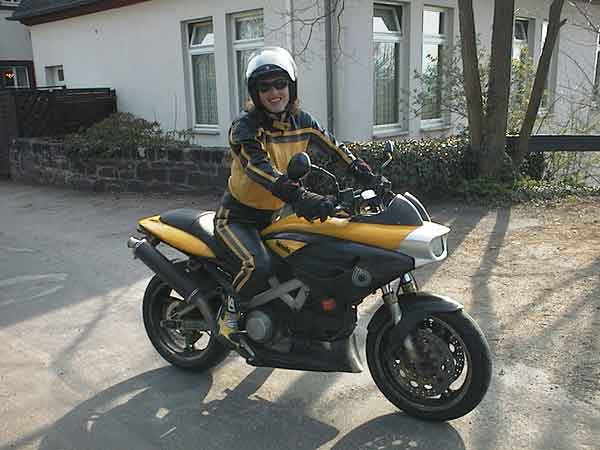 Sylvia in yellow leather suit, on yellow Bimota Mantra