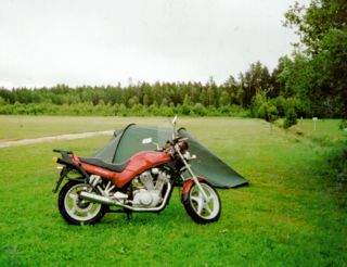 Suzuki VX800 next to a tent