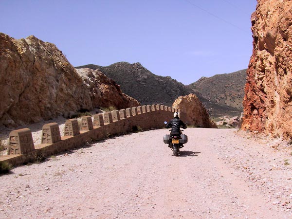 Riding between red rocks