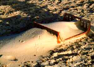 Wooden crate with sand