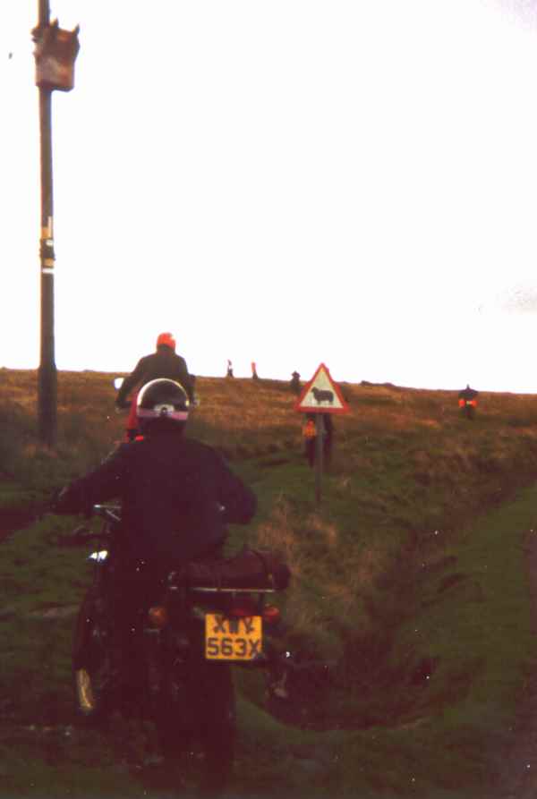 Motorcycles and a sign warning for sheep