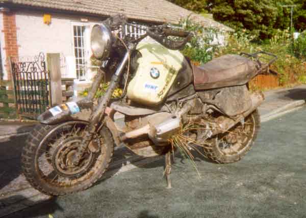 Very dirty BMW R1100GS: grass sticking out of the cylinders