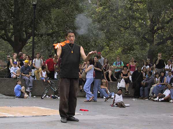 Karate man with torch and begging hand