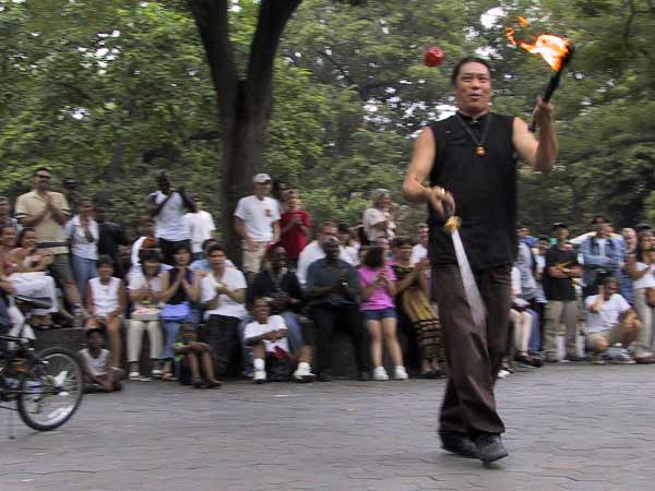 Master Lee, juggling with apple, sword and torch