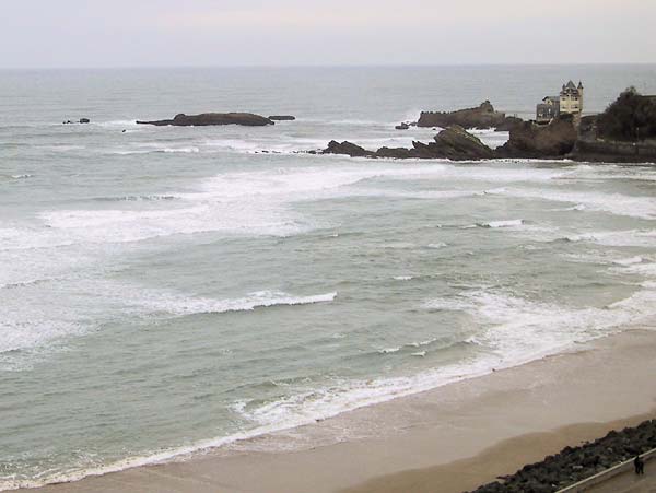 house on a rock in the ocean