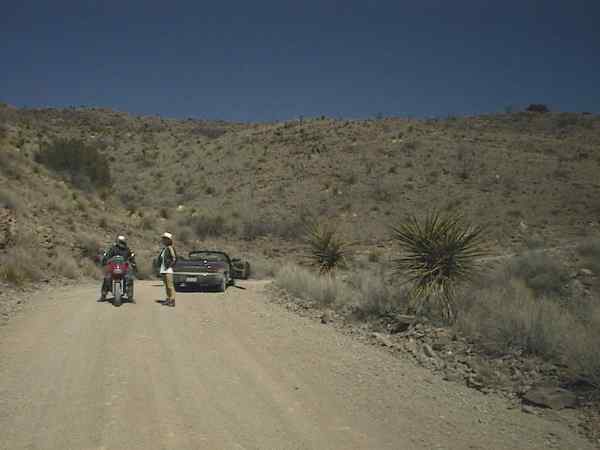 A motorcycle on an unpaved road