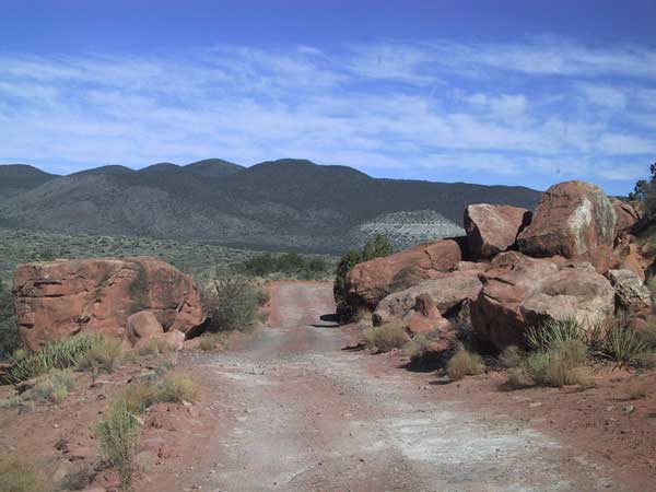 Big red round rocks next to the road