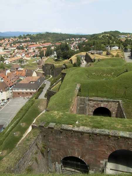 Grassy hills, with openings to cellars here and there